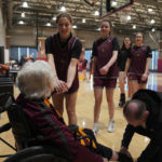 
              Loyola University women's basketball players greet Sister Jean Dolores Schmidt with a handshake after practice on Monday, Jan. 23, 2023, in Chicago. (AP Photo/Jessie Wardarski)
            