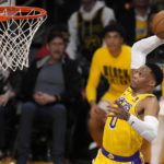 Los Angeles Lakers guard Russell Westbrook dunks during the first half of an NBA basketball game against the Oklahoma City Thunder Tuesday, Feb. 7, 2023, in Los Angeles. (AP Photo/Marcio Jose Sanchez)