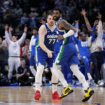 
              Dallas Mavericks' Luka Doncic (77) and Kyrie Irving, right, celebrate at mid-court in the second half of an NBA basketball game against the Minnesota Timberwolves, Monday, Feb. 13, 2023, in Dallas. (AP Photo/Tony Gutierrez)
            
