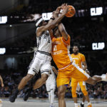 Tennessee forward Tobe Awaka (11) collides with Vanderbilt guard Ezra Manjon (5) as they went for a rebound during the second half of an NCAA college basketball game Wednesday, Feb. 8, 2023, in Nashville, Tenn. (AP Photo/Wade Payne)
