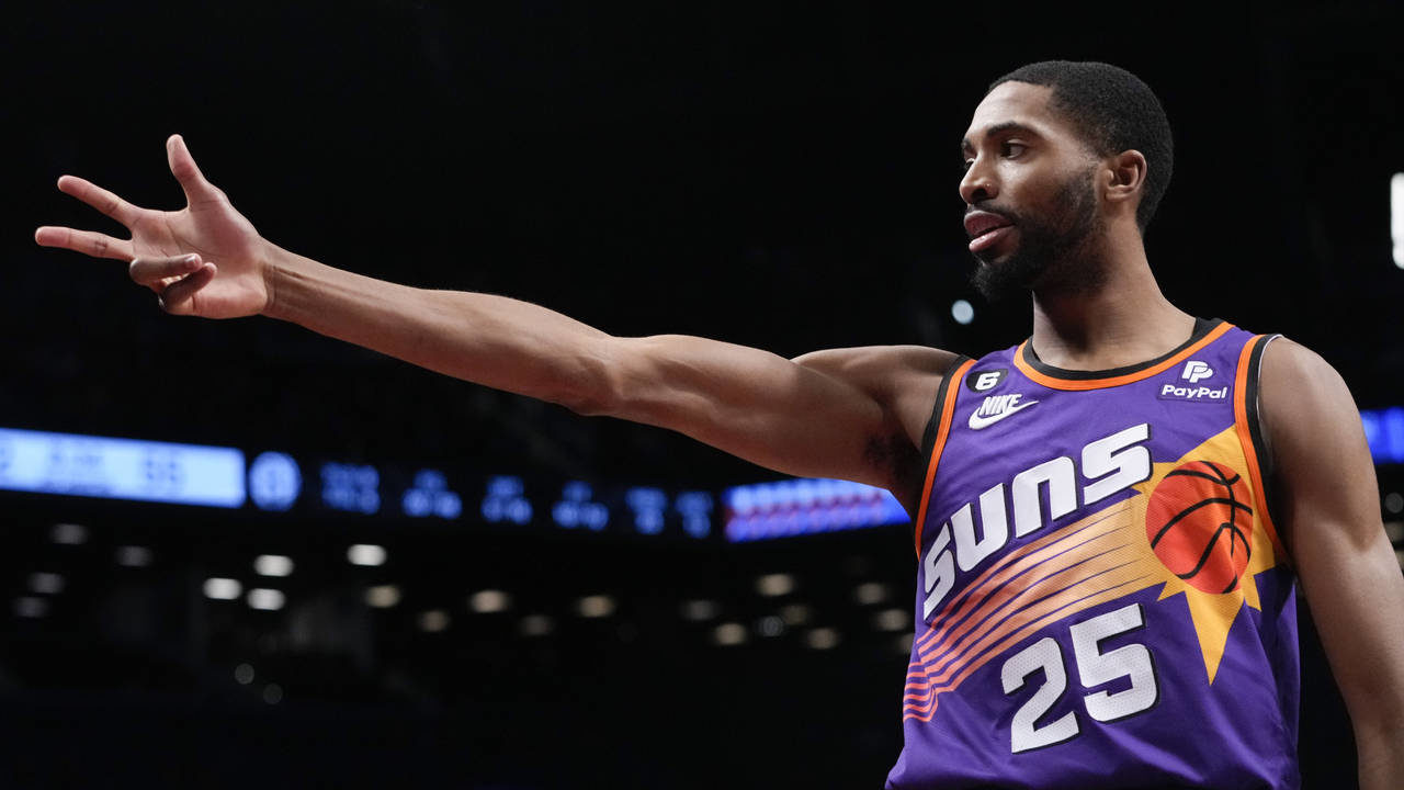 Phoenix Suns forward Mikal Bridges reacts after scoring a three-point basket during the second half...