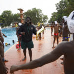 
              Asante Prince, the founder of Ghana's Awatu Winton Water Polo Club, shares tips with participants at the University of Ghana ahead of the Black Star water polo competition in Accra, Ghana, Saturday, Jan. 14, 2023. Former water polo pro Asante Prince is training young players in the sport in his father's homeland of Ghana, where swimming pools are rare and the ocean is seen as dangerous. (AP Photo/Misper Apawu)
            