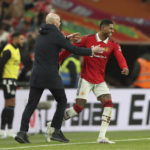 Manchester United's head coach Erik ten Hag, left, and Manchester United's Marcus Rashford celebrate after winning the English League Cup final soccer match between Manchester United and Newcastle United at Wembley Stadium in London, Sunday, Feb. 26, 2023. Manchester United won 2-0. (AP Photo/Scott Heppell)
