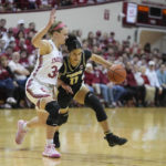 Purdue's Lasha Petree (11) goes to the basket against Indiana's Grace Berger (34) during the first half of an NCAA college basketball game, Sunday, Feb. 19, 2023, in Bloomington, Ind. (AP Photo/Darron Cummings)