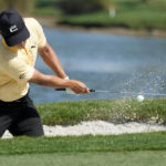 
              Justin Suh hits from a bunker onto the third green during the final round of the Honda Classic golf tournament, Sunday, Feb. 26, 2023, in Palm Beach Gardens, Fla. (AP Photo/Lynne Sladky)
            