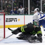 Dallas Stars goaltender Scott Wedgewood (41) is unable to stop a goal scored by Tampa Bay Lightning's Anthony Cirelli (71) in the second period of an NHL hockey game, Saturday, Feb. 11, 2023, in Dallas. (AP Photo/Tony Gutierrez)