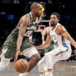 
              Milwaukee Bucks forward Khris Middleton (22) drives around Brooklyn Nets guard Spencer Dinwiddie (26) during the second half of an NBA basketball game, Tuesday, Feb. 28, 2023, in New York. (AP Photo/John Minchillo)
            