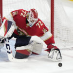 
              Florida Panthers goaltender Sergei Bobrovsky reaches for the puck to make a save during the third period of an NHL hockey game against the San Jose Sharks, Thursday, Feb. 9, 2023, in Sunrise, Fla. (AP Photo/Wilfredo Lee)
            
