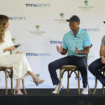 
              Golfers Tiger Woods, center, and Rory McIlroy, right, talk to host Erin Andrews as they discuss the future home of their tech-infused golf league that will begin play next year, Tuesday, Feb. 21, 2023, on the campus of Palm Beach State College in Palm Beach Gardens, Fla. (AP Photo/Wilfredo Lee)
            