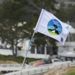 The flagstick on the 4th green of the Pebble Beach Golf Links sways with the wind during the third round of the AT&T Pebble Beach Pro-Am golf tournament in Pebble Beach, Calif., Saturday, Feb. 4, 2023. The third round of the tournament was suspended due to high wind. (AP Photo/Godofredo A. Vásquez)
