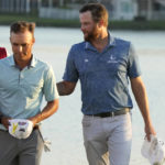 
              Eric Cole, left, and Chris Kirk, right, walk off the 18th green after regulation play during the final round of the Honda Classic golf tournament, Sunday, Feb. 26, 2023, in Palm Beach Gardens, Fla. Kirk went on to win in a playoff. (AP Photo/Lynne Sladky)
            