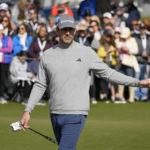 
              Aaron Rogers urges his ball to the left during the putting challenge event of the AT&T Pebble Beach Pro-Am golf tournament in Pebble Beach, Calif., Wednesday, Feb. 1, 2023. (AP Photo/Eric Risberg)
            