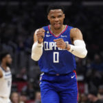
              Los Angeles Clippers guard Russell Westbrook (0) celebrates after making a 3-point basket during the first half of an NBA basketball game against the Minnesota Timberwolves Tuesday, Feb. 28, 2023, in Los Angeles. (AP Photo/Marcio Jose Sanchez)
            