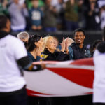 FILE - First lady Jill Biden, center, stands on the field before an NFL football game between the Philadelphia Eagles and Dallas Cowboys on Oct. 16, 2022, in Philadelphia. (AP Photo/Matt Rourke, File)