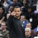
              Boston Celtics head coach Joe Mazzulla signals from the sideline during the first half of an NBA basketball game against the Detroit Pistons, Monday, Feb. 6, 2023, in Detroit. (AP Photo/Carlos Osorio)
            