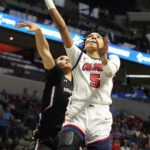 Mississippi forward Snudda Collins (5) shoots a layup past South Carolina guard Brea Beal during the second half of an NCAA college basketball game in Oxford, Miss., Sunday, Feb. 19, 2023. (AP Photo/Rogelio V. Solis)