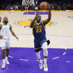 
              Golden State Warriors forward Draymond Green, right, shoots as Los Angeles Lakers forward Jarred Vanderbilt, left, and forward LeBron James defend during the first half of an NBA basketball game Thursday, Feb. 23, 2023, in Los Angeles. (AP Photo/Mark J. Terrill)
            