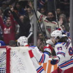 New York Rangers' Mika Zibanejad (93) celebrates his goal against the Vancouver Canucks during the first period of an NHL hockey game Wednesday, Feb. 15, 2023, in Vancouver, British Columbia. (Darryl Dyck/The Canadian Press via AP)