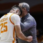 Tennessee head coach Rick Barnes hugs guard Santiago Vescovi (25) after he made his free throws in the final seconds of the second half of an NCAA college basketball game against Alabama, Wednesday, Feb. 15, 2023, in Knoxville, Tenn. (AP Photo/Wade Payne)
