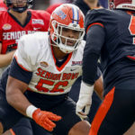 
              American lineman O'Cyrus Torrence of Florida (56) blocks out during practice for the Senior Bowl NCAA college football game Wednesday, Feb. 1, 2023, in Mobile, Ala.. (AP Photo/Butch Dill)
            