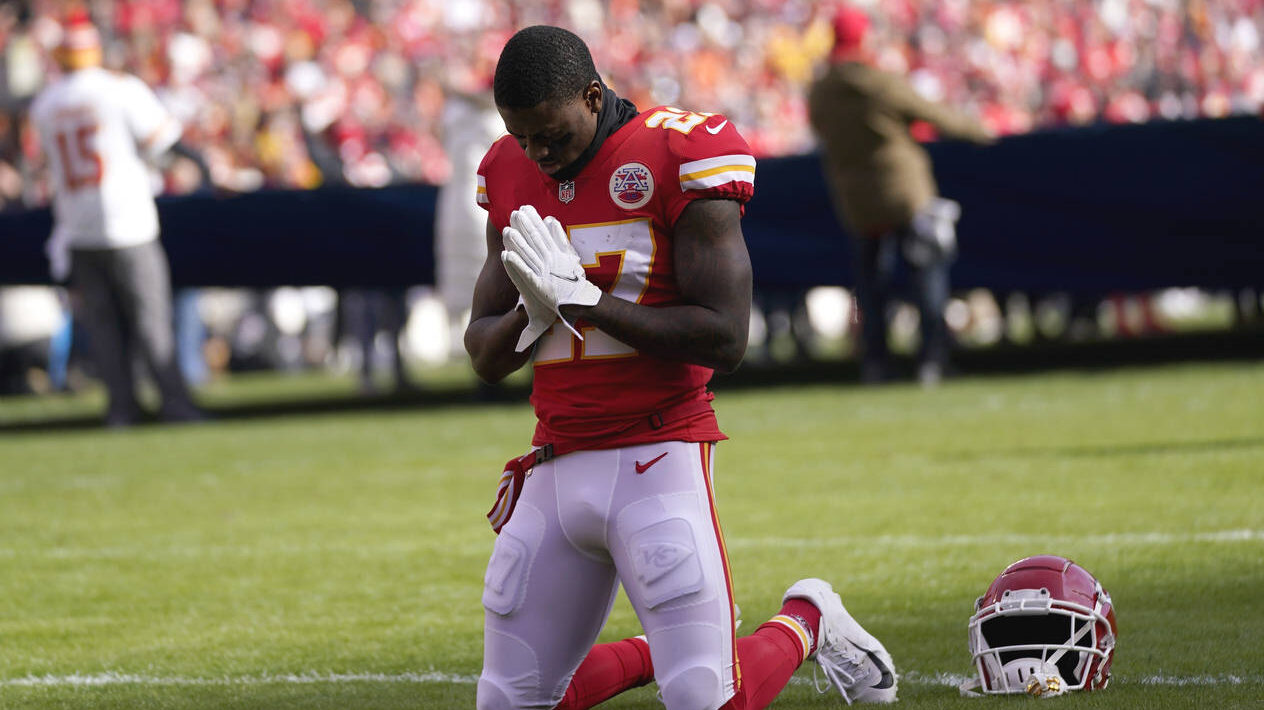 Kansas City Chiefs cornerback Rashad Fenton kneels on the field before the AFC championship NFL foo...