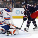 
              Edmonton Oilers goalie Stuart Skinner, left, stops a shot by Columbus Blue Jackets forward Boone Jenner during the second period of an NHL hockey game in Columbus, Ohio, Saturday, Feb. 25, 2023. (AP Photo/Paul Vernon)
            