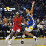 Portland Trail Blazers forward Jerami Grant (9) drives to the basket against Golden State Warriors guard Jordan Poole during the first half of an NBA basketball game in San Francisco, Tuesday, Feb. 28, 2023. (AP Photo/Jeff Chiu)