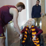 
              Loyola University basketball player, Tom Welch, shakes hands with Sister Jean Dolores Schmidt, the team's official chaplain, before attending practice on Monday, Jan. 23, 2023, in Chicago. The beloved Catholic nun captured the world's imagination and became something of a folk hero while supporting the Ramblers at the NCAA Final Four in 2018. At the age of 103, Sister Jean is using her platform to publish her first book, "Wake Up with Purpose: What I've Learned in My First Hundred Years." In the memoir she tells her story and offers life lessons and spiritual guidance. (AP Photo/Jessie Wardarski)
            