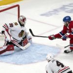 Montreal Canadiens Joel Armia (40) scores on Chicago Blackhawks goaltender Jaxson Stauber (30) during the third period of an NHL hockey game, Tuesday, Feb.14, 2023 in Montreal. (Ryan Remiorz/The Canadian Press via AP)
