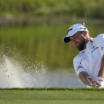 
              Shane Lowry, of Ireland, hits from a bunker onto the 16th green during the second round of the Honda Classic golf tournament, Friday, Feb. 24, 2023, in Palm Beach Gardens, Fla. (AP Photo/Lynne Sladky)
            