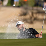 
              Jon Rahm blast out of the sand on the 15th hole for an eagle during the second round of the Phoenix Open golf tournament Friday Feb. 10, 2023, in Scottsdale, Ariz. (AP Photo/Darryl Webb)
            