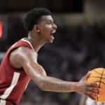 
              Alabama guard Jaden Bradley shouts to teammates during the second half of an NCAA college basketball game against South Carolina Wednesday, Feb. 22, 2023, in Columbia, S.C. Alabama won 78-76 in overtime. (AP Photo/Sean Rayford)
            