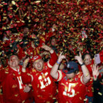 Kansas City Chiefs fans celebrate their team's win at the end of the NFL Super Bowl 57 football game against the Philadelphia Eagles at a watch party in the Power and Light entertainment district in Kansas City, Mo., Sunday, Feb. 12, 2023. (AP Photo/Colin E. Braley)