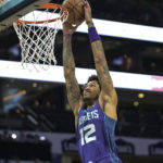 Charlotte Hornets guard Kelly Oubre Jr. (12) goes up for a slam dunk during the first half of an NBA basketball game against the Miami Heat, Saturday, Feb. 25, 2023, in Charlotte, N.C. (AP Photo/Matt Kelley)