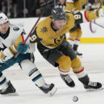 
              San Jose Sharks left wing Alexander Barabanov (94) and Vegas Golden Knights center Jack Eichel (9) vie for the puck during the second period of an NHL hockey game Thursday, Feb. 16, 2023, in Las Vegas. (AP Photo/John Locher)
            