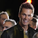 
              NFL quarterback Tom Brady, a cast member and producer of "80 for Brady," looks down the carpet at the premiere of the film, Tuesday, Jan. 31, 2023, at the Regency Village Theatre in Los Angeles. (AP Photo/Chris Pizzello)
            
