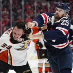 Washington Capitals defenseman Dylan McIlrath, right, punches Anaheim Ducks center Sam Carrick during a fight in the second period of an NHL hockey game, Thursday, Feb. 23, 2023, in Washington. (AP Photo/Patrick Semansky)