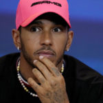 
              FILE - Lewis Hamilton of Great Britain and Mercedes reacts in a press conference during previews ahead of the F1 Grand Prix of Abu Dhabi at Yas Marina Circuit in Abu Dhabi, United Arab Emirates, Nov. 17, 2022. Mercedes will return to its all-black color scheme in a bid to shave weight from its car and be competitive again after last year's winless season for Lewis Hamilton. The car was revealed Wednesday, Feb. 15, 2023 amid a promise from Mercedes team principal Toto Wolff that the car will be competitive.  (AP Photo/Kamran Jebreili, file)
            