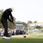 
              Tiger Woods hits from the ninth tee during the second round of the Genesis Invitational golf tournament at Riviera Country Club, Friday, Feb. 17, 2023, in the Pacific Palisades area of Los Angeles. (AP Photo/Ryan Kang)
            