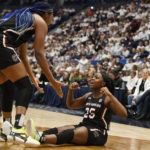 South Carolina's Raven Johnson (25) reacts toward teammate Aliyah Boston, left, in the first half of an NCAA college basketball game, Sunday, Feb. 5, 2023, in Hartford, Conn. (AP Photo/Jessica Hill)