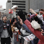 
              Kansas City Chiefs tight end Noah Gray celebrates with fans during the NFL football team's victory celebration and parade in Kansas City, Mo., Wednesday, Feb. 15, 2023, following the Chiefs' win over the Philadelphia Eagles Sunday in the NFL Super Bowl 57 football game. (AP Photo/Colin E. Braley)
            