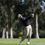 
              Collin Morikawa hits his second shot on the 13th hole during the pro-am of the Genesis Invitational golf tournament at Riviera Country Club, Wednesday, Feb. 15, 2023, in the Pacific Palisades area of Los Angeles. (AP Photo/Ryan Kang)
            