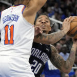 
              Orlando Magic's Markelle Fultz (20) tries to find a teammate to pass to as New York Knicks' Jalen Brunson (11) defends during the second half of an NBA basketball game Tuesday, Feb. 7, 2023, in Orlando, Fla. (AP Photo/John Raoux)
            