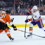 New York Islanders' Bo Horvat, right, shoots the puck against Philadelphia Flyers' Cam York during the first period of an NHL hockey game, Monday, Feb. 6, 2023, in Philadelphia. (AP Photo/Matt Slocum)