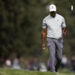 
              Tiger Woods acknowledges the crowd after making birdie on the 10th hole during the third round of the Genesis Invitational golf tournament at Riviera Country Club, Saturday, Feb. 18, 2023, in the Pacific Palisades area of Los Angeles. (AP Photo/Ryan Kang)
            