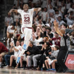 South Carolina forward Gregory Jackson II celebrates a teammate's three-pointer during the first half of an NCAA college basketball game Wednesday, Feb. 22, 2022, in Columbia, S.C. (AP Photo/Sean Rayford)