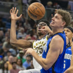 
              Indiana Pacers forward Serge Ibaka (25) grabs for the rebound against Orlando Magic center Moritz Wagner, front right, during the first half of an NBA basketball game Saturday, Feb. 25, 2023, in Orlando, Fla. (AP Photo/Alan Youngblood)
            