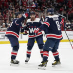 Washington Capitals right wing T.J. Oshie, left, celebrates his goal with teammates Erik Gustafsson, center, and Alex Ovechkin in the first period of an NHL hockey game against the Anaheim Ducks, Thursday, Feb. 23, 2023, in Washington. (AP Photo/Patrick Semansky)