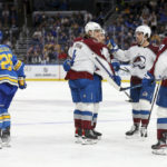 Colorado Avalanche's Bowen Byram (4) is congratulated by teammates after scoring a goal against the St. Louis Blues during the third period of an NHL hockey game Saturday, Feb. 18, 2023, in St. Louis. (AP Photo/Scott Kane)