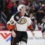 Anaheim Ducks defenseman Simon Benoit skates off the ice after fighting with Washington Capitals right wing Tom Wilson in the second period of an NHL hockey game, Thursday, Feb. 23, 2023, in Washington. (AP Photo/Patrick Semansky)